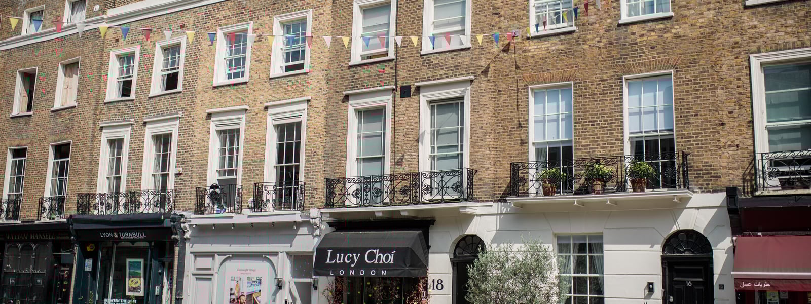 An image of a selection of shops in Connaught Village