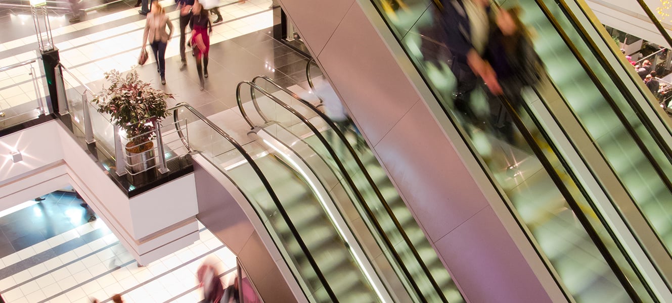 People in the multilevel mall, motion blurred