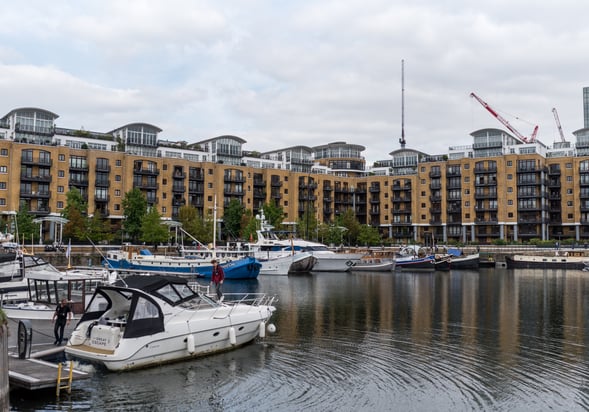 Boats on St Katherine Docks in front of residential proeprties