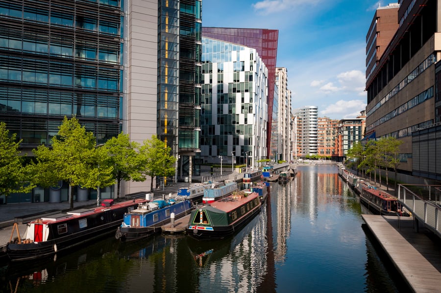 Rows of houseboats and narrow boats on the canal banks at Paddington Basin in Little Venice, London