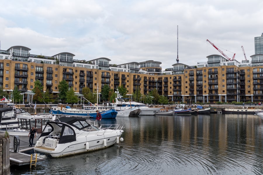 Boats on St Katherine Docks in front of residential proeprties